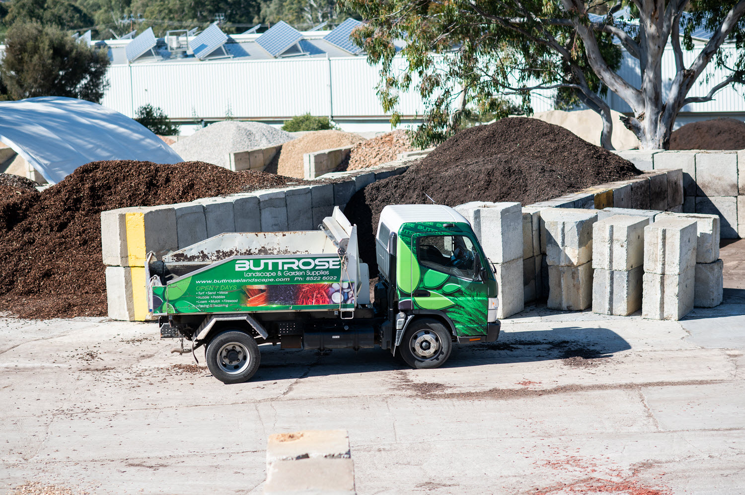 Buttrose Landscape Yard truck with soil in background
